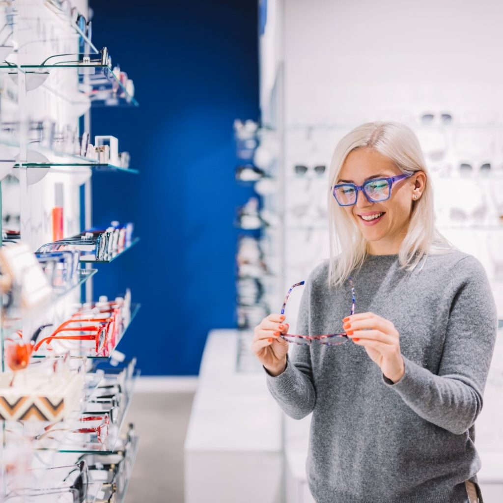 woman-trying-on-glasses-square Woman Trying on Glasses